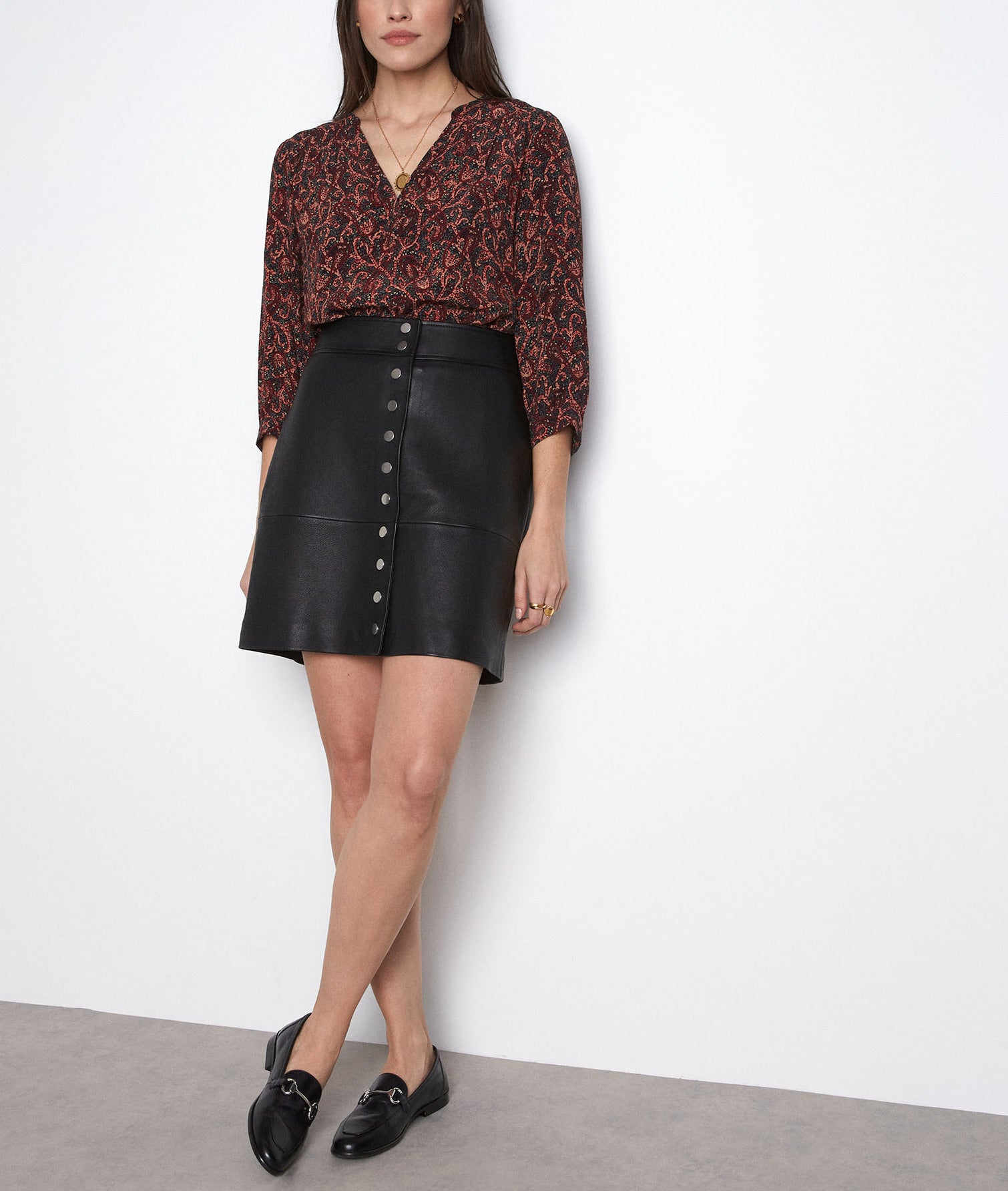 Mini-jupe boutonnée en cuir noir Dana Faume - seconde main