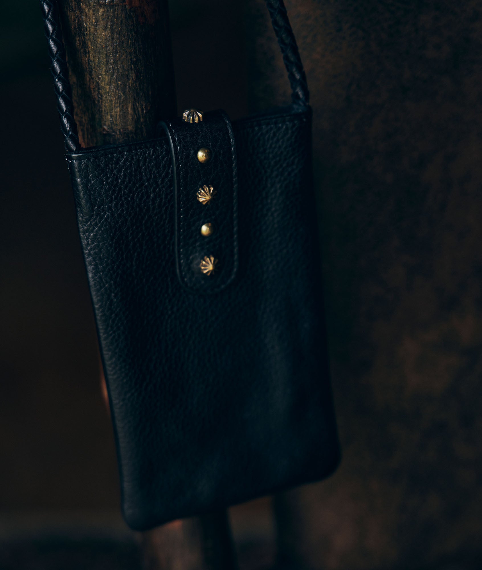 Pochette téléphone en cuir grainé noir Larry Faume - seconde main